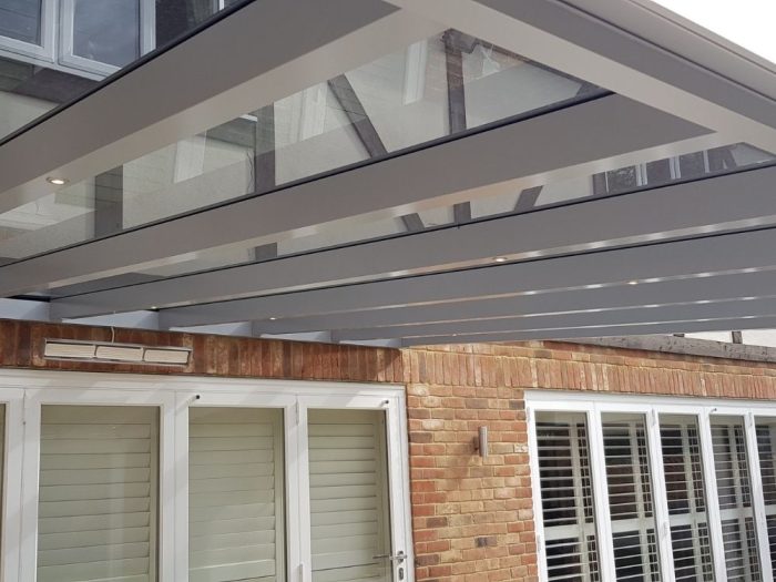 Metal pergolas add a modern spin on the more traditional wooden frames. Image source: Cotswold Awnings & Pergolas
